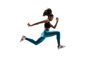 Image showing Young african woman running or jogging isolated on white studio background.