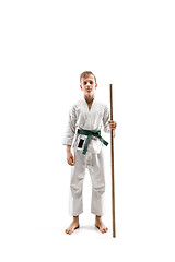 Image showing Teen boy fighting with wooden sword at Aikido training in martial arts school