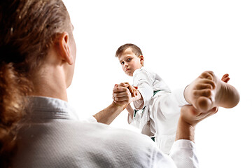 Image showing Man and teen boy fighting at aikido training in martial arts school