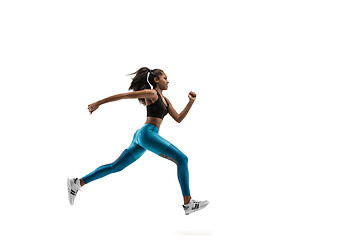 Image showing Young african woman running or jogging isolated on white studio background.