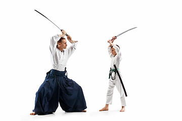 Image showing Man and teen boy fighting at aikido training in martial arts school