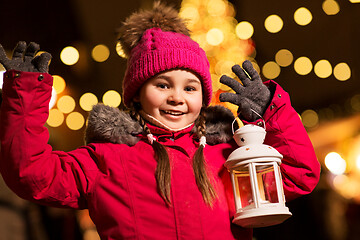 Image showing happy little girl at christmas with lantern market