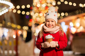 Image showing happy girl with cup of tea at christmas market