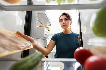 Image showing woman taking food from fridge at home