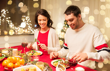 Image showing happy couple eating at christmas dinner