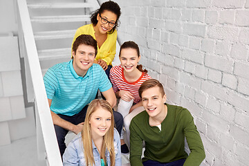 Image showing teenage friends or students hanging out on stairs