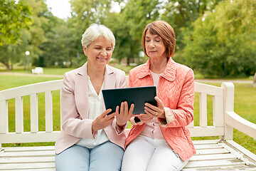 Image showing senior women with tablet pc at summer park