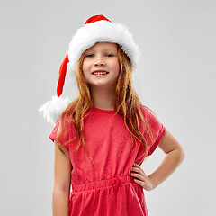 Image showing smiling red haired girl posing in snata helper hat