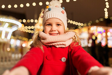 Image showing little girl taking selfie at christmas market