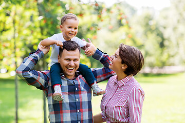 Image showing happy family having fun at summer park