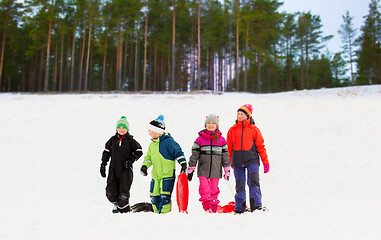 Image showing happy little kids with sleds in winter