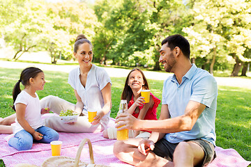 Image showing happy family having picnic at summer park