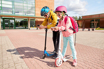 Image showing school children with smartphones and scooters