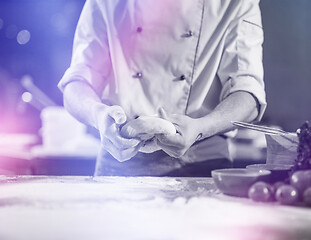 Image showing chef hands preparing dough for pizza