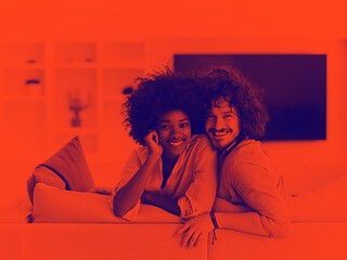 Image showing young multiethnic couple in living room