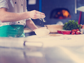 Image showing chef hands preparing dough for pizza