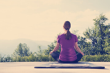 Image showing handsome woman doing morning yoga exercises