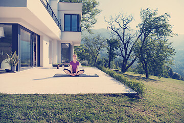 Image showing handsome woman doing morning yoga exercises