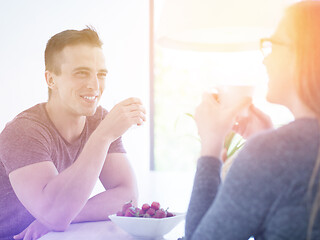 Image showing couple enjoying morning coffee and strawberries