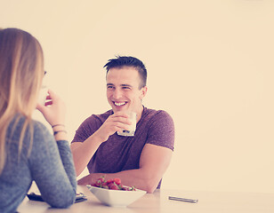 Image showing couple enjoying morning coffee and strawberries