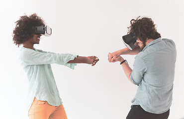 Image showing multiethnic couple getting experience using VR headset glasses