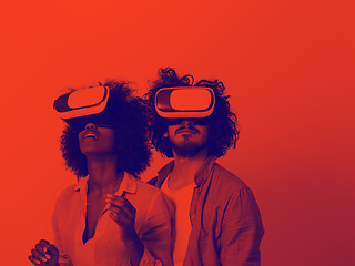 Image showing multiethnic couple getting experience using VR headset glasses