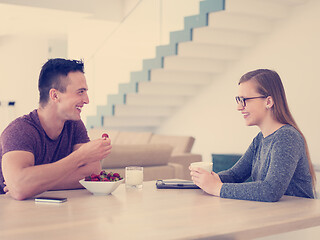 Image showing couple enjoying morning coffee and strawberries