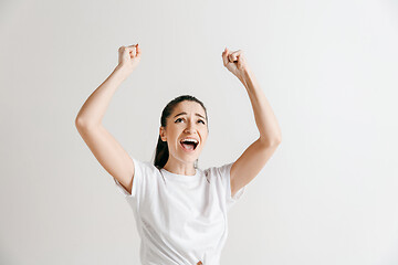 Image showing Winning success woman happy ecstatic celebrating being a winner.