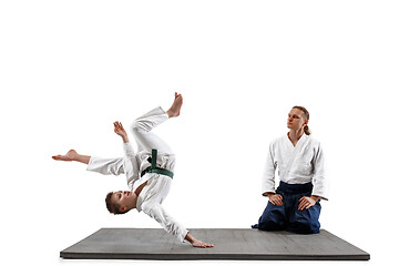 Image showing Man and teen boy fighting at aikido training in martial arts school