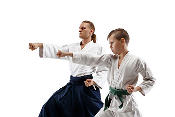 Image showing Man and teen boy fighting at aikido training in martial arts school