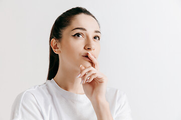 Image showing Young serious thoughtful business woman. Doubt concept.