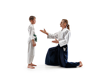 Image showing Man and teen boy fighting at aikido training in martial arts school