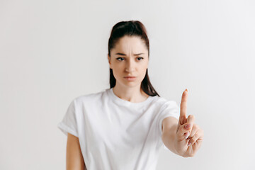 Image showing Woman\'s hand with finger on gray background