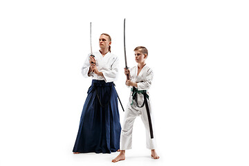 Image showing Man and teen boy fighting at aikido training in martial arts school