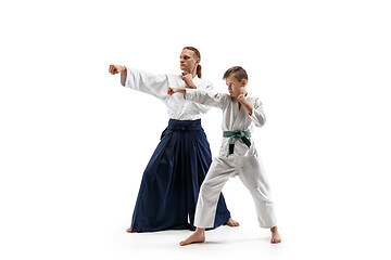 Image showing Man and teen boy fighting at aikido training in martial arts school