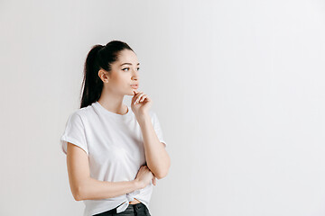 Image showing Young serious thoughtful business woman. Doubt concept.