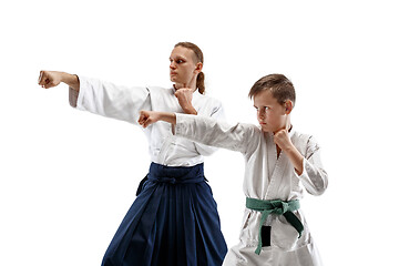 Image showing Man and teen boy fighting at aikido training in martial arts school