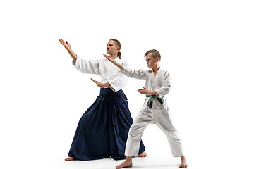 Image showing Man and teen boy fighting at aikido training in martial arts school