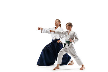 Image showing Man and teen boy fighting at aikido training in martial arts school