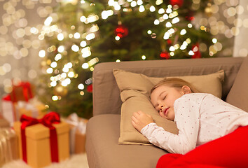 Image showing girl sleeping on sofa at christmas