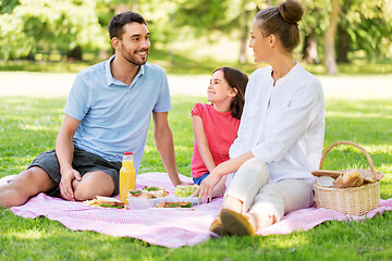 Image showing happy family having picnic at summer park