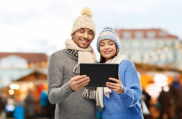 Image showing couple with tablet computer at christmas market