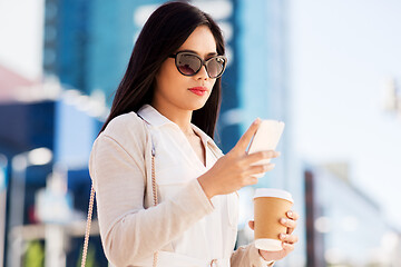 Image showing woman with smartphone and coffee in city