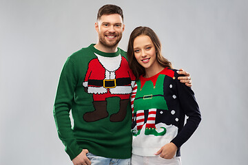 Image showing happy couple at christmas ugly sweater party