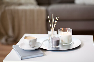 Image showing coffee, candles and aroma reed diffuser on table