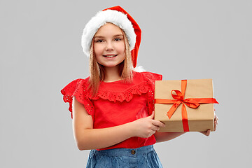 Image showing smiling girl in snata hat with christmas gift