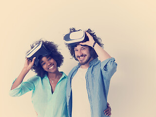 Image showing multiethnic couple getting experience using VR headset glasses