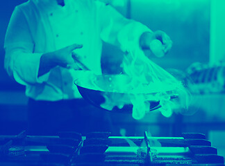 Image showing Chef doing flambe on food