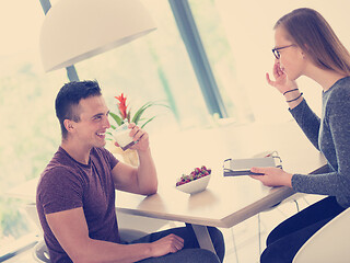 Image showing couple enjoying morning coffee and strawberries