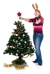 Image showing Happy girl decorating Christmas tree